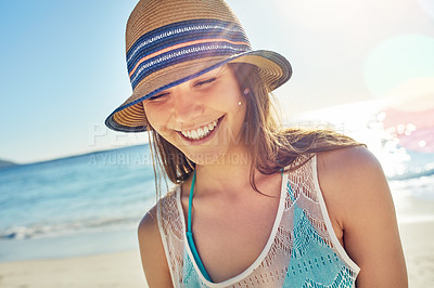 Buy stock photo Cropped shot of a beautiful young woman spending the day at the beach