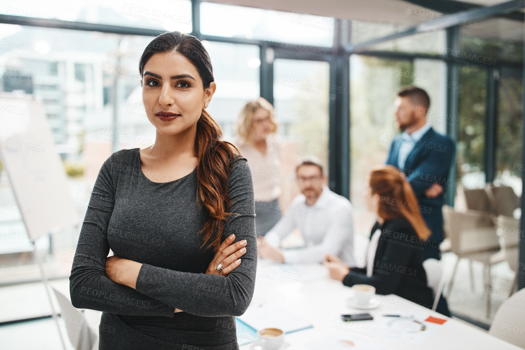 Buy stock photo Crossed arms, discussion and portrait of business woman in office with confidence for career growth. Smile, pride and female finance banker with team for company investment with meeting in boardroom.