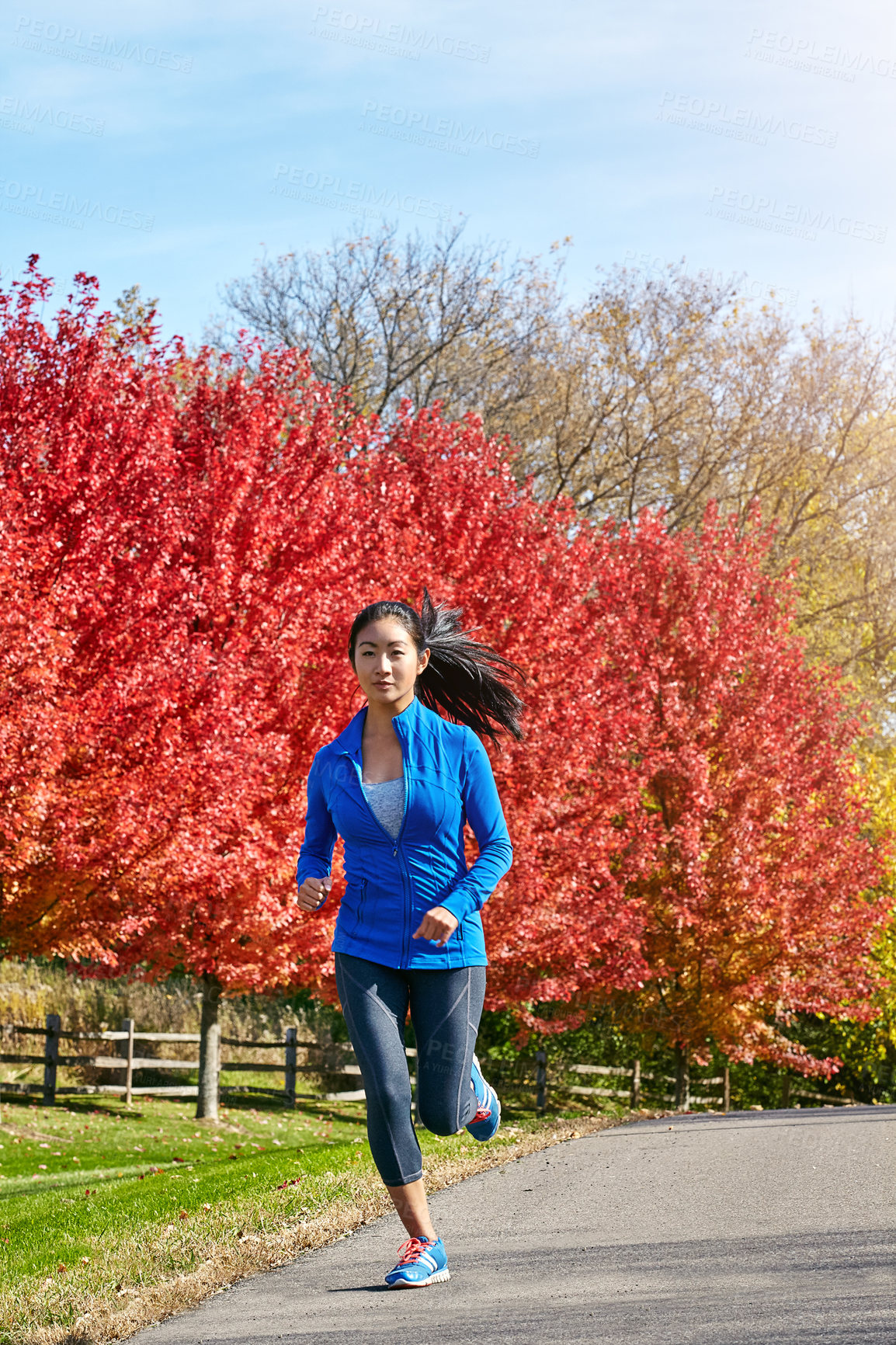 Buy stock photo Asian woman, running and fitness with workout for cardio exercise or outdoor training in countryside. Active female person, athlete or runner for sprint, health and wellness in road, autumn or nature