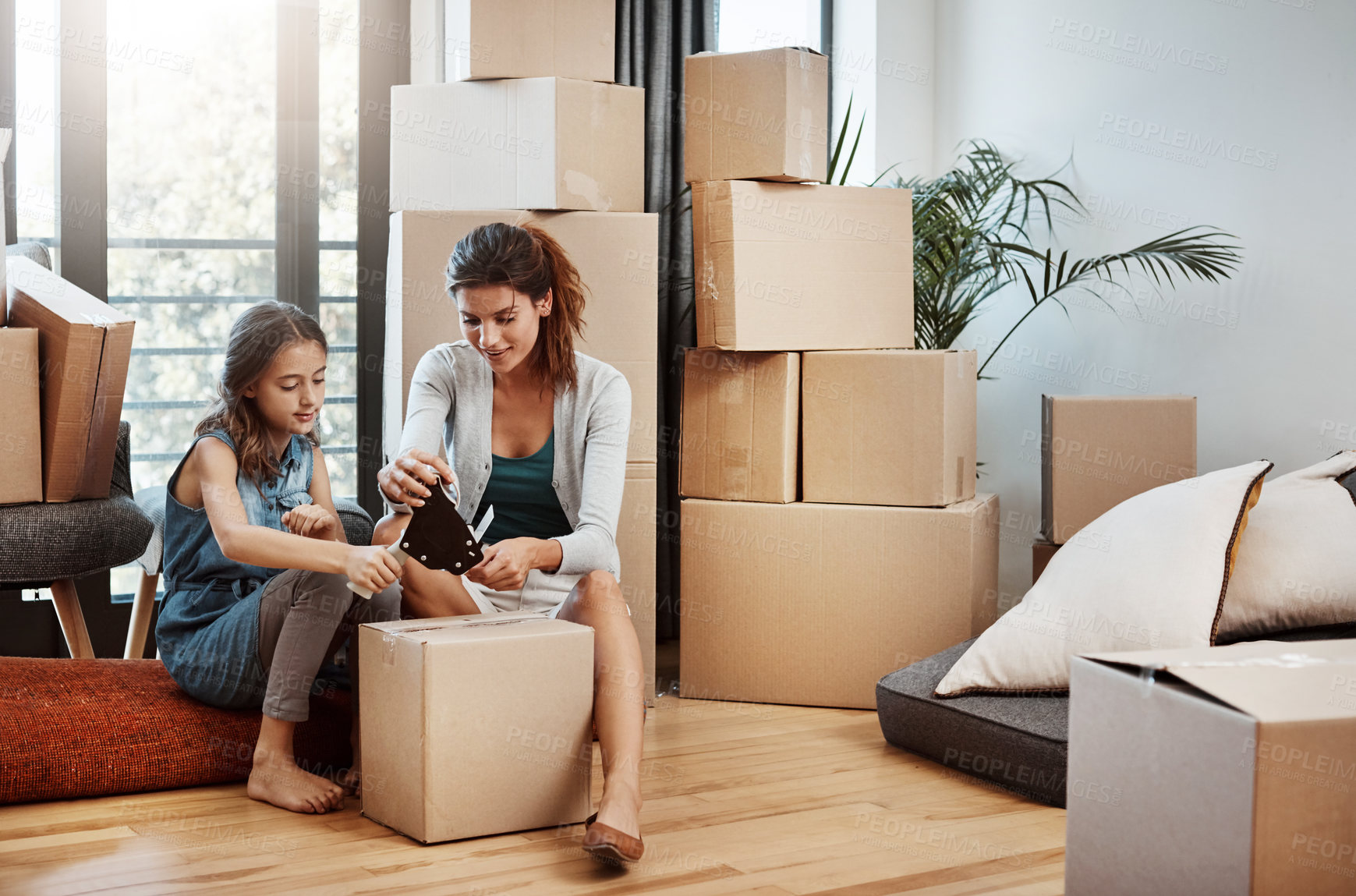 Buy stock photo Mother, girl and help with packing boxes for new home with moving, mortgage investment and property relocation. Woman, daughter and support with tape for cardboard package or real estate in apartment