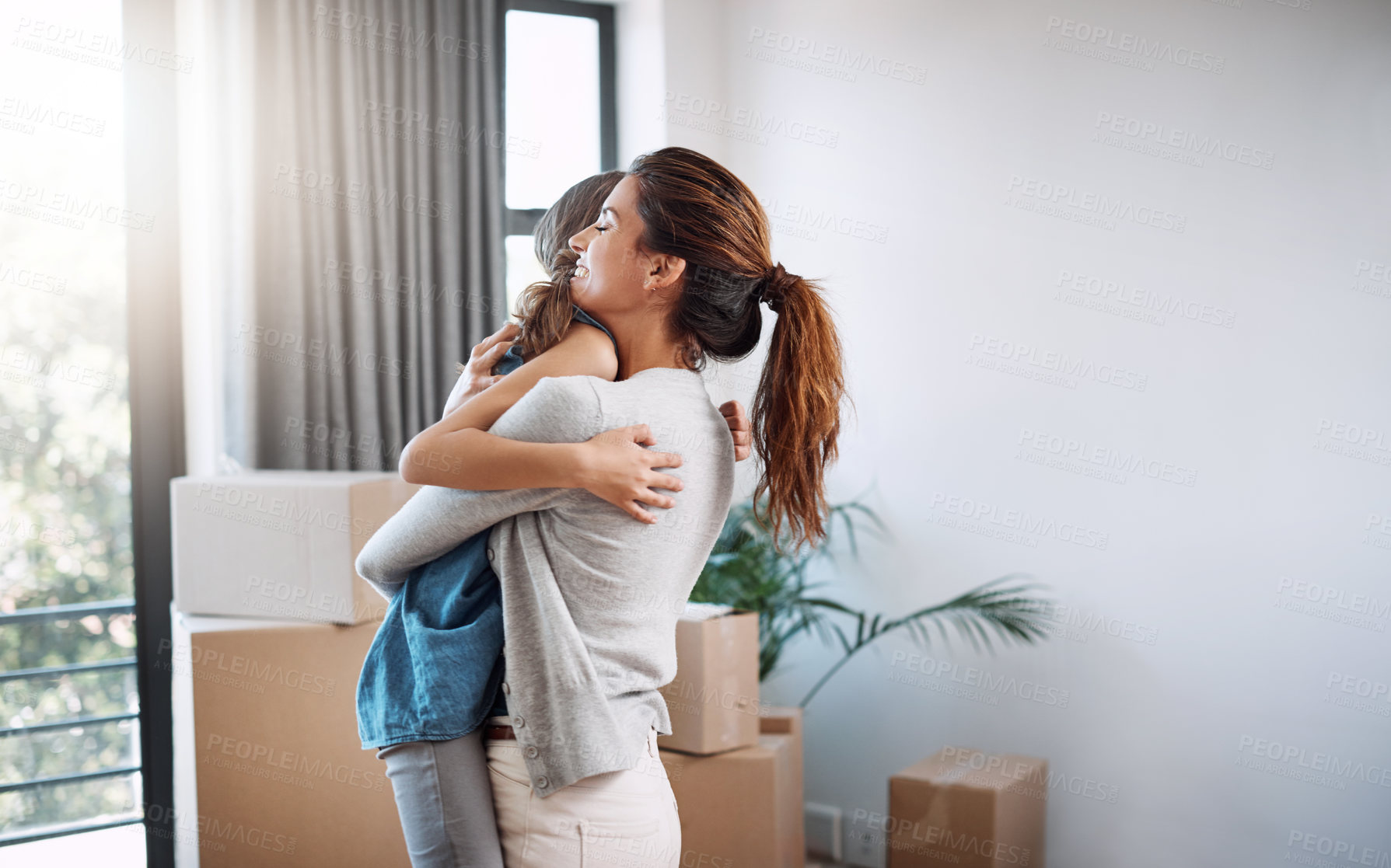 Buy stock photo New home, mom and hug kid for moving, mortgage and celebrate property investment. Mother, girl and embrace child for custody win in house, relocation and success of happy family in dream apartment