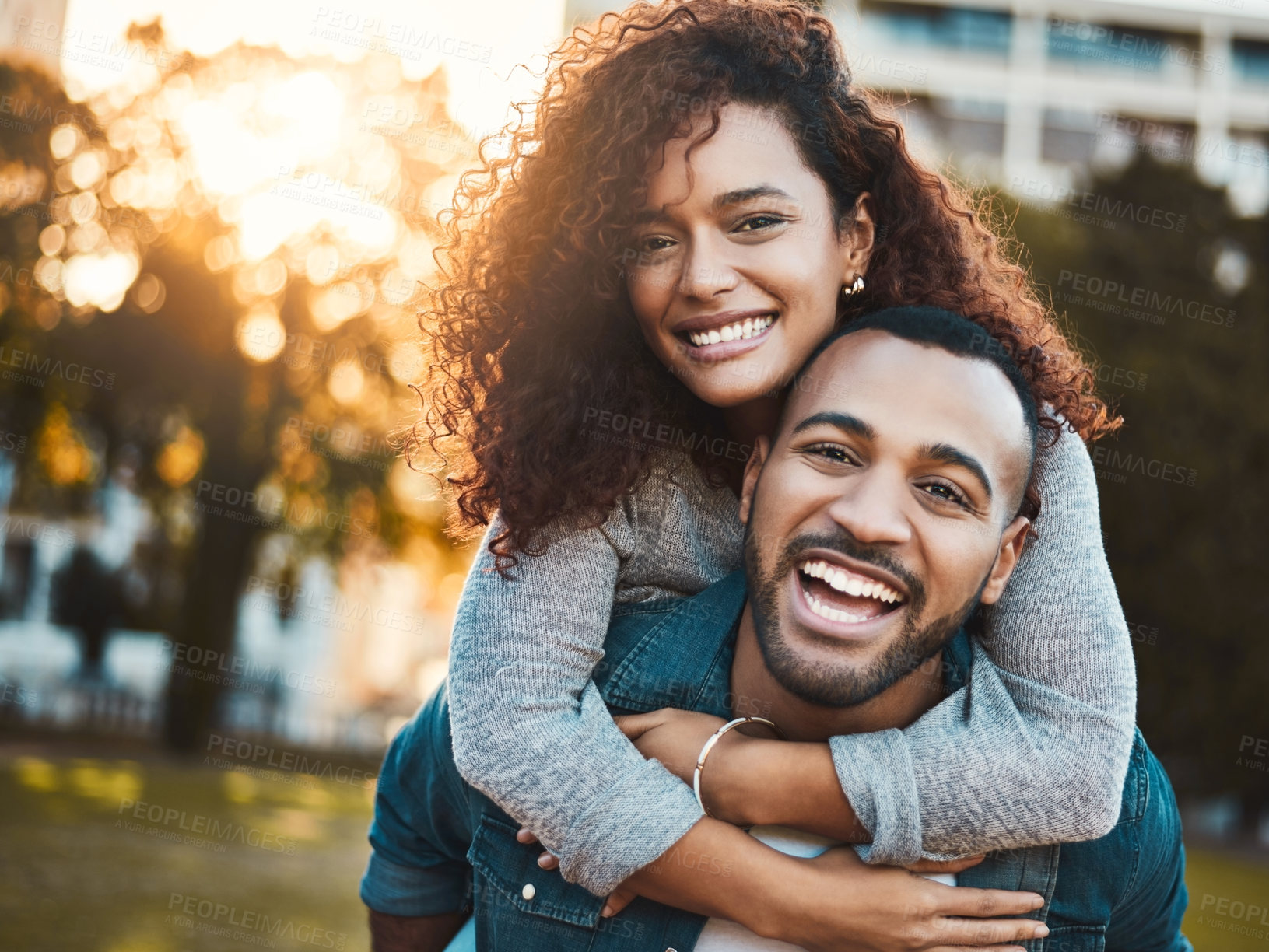 Buy stock photo Happy couple, piggyback and portrait in outdoor, laughing and relationship bonding in park. People, together and romance on weekend trip for marriage, carrying and embrace adventure on vacation