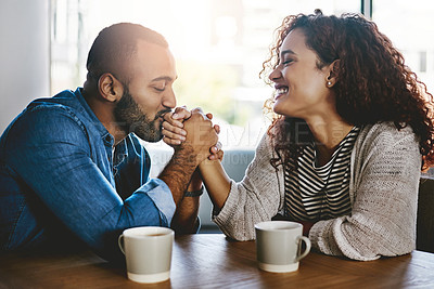Buy stock photo Shot of a young couple spending time together at a cafe