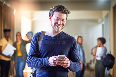 Buy stock photo Shot of a university student using a cellphone at campus