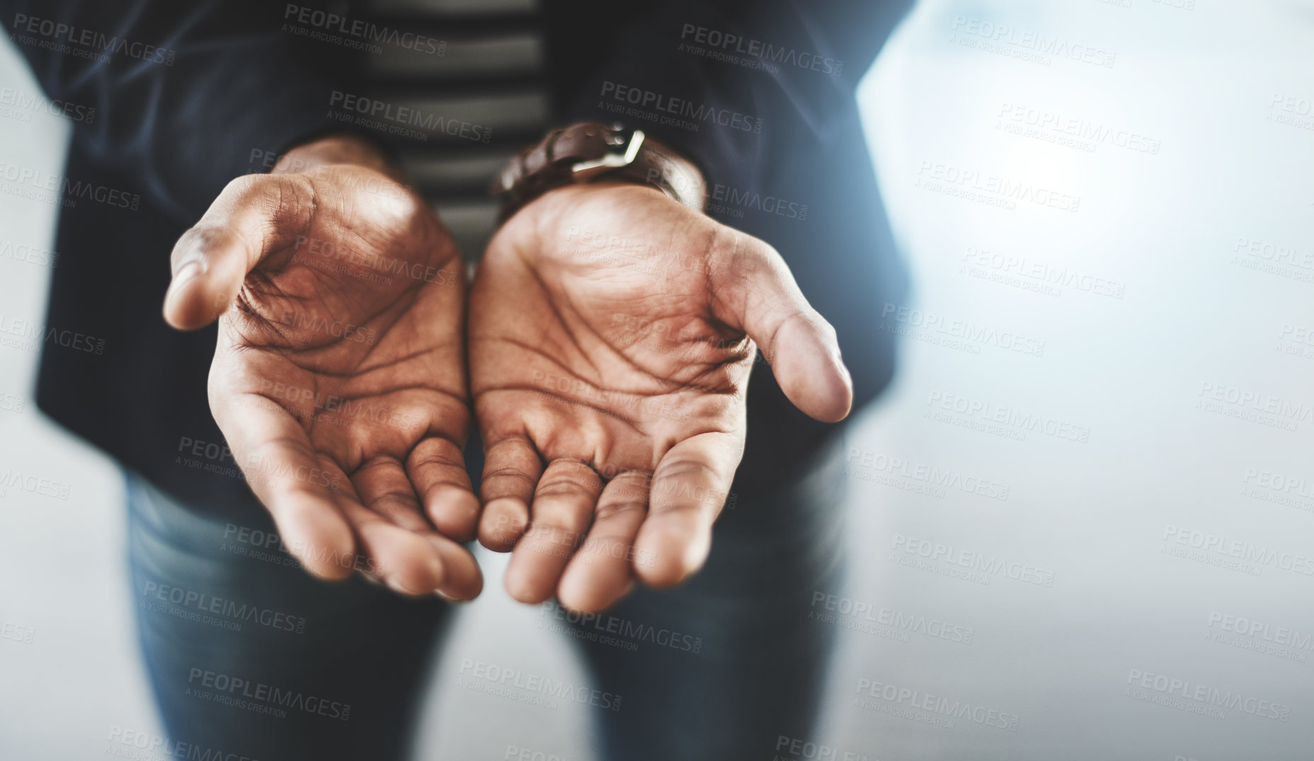 Buy stock photo Closeup shot of an unrecognizable businessman standing with his hands cupped together