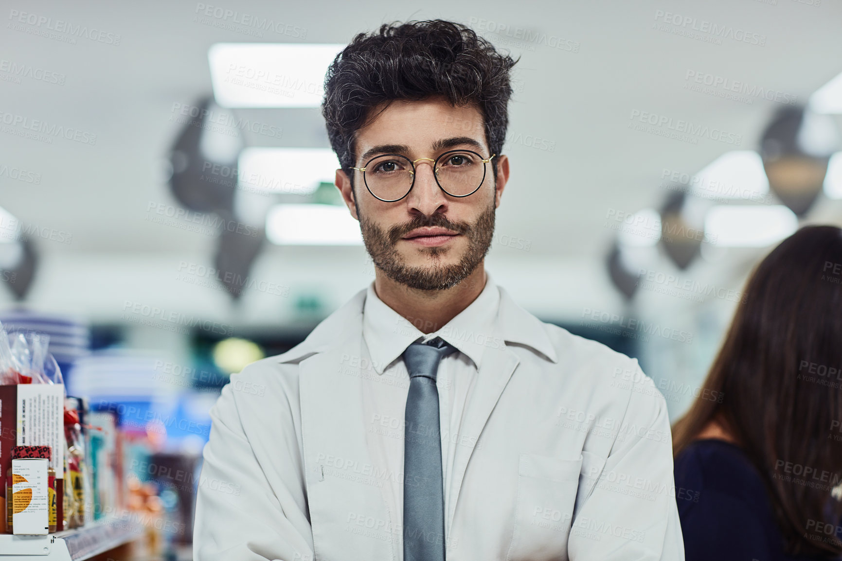 Buy stock photo Cropped portrait of a handsome young male pharmacist working in a pharmacy