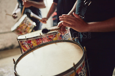 Buy stock photo Closeup shot of a musical performer playing drums with his band