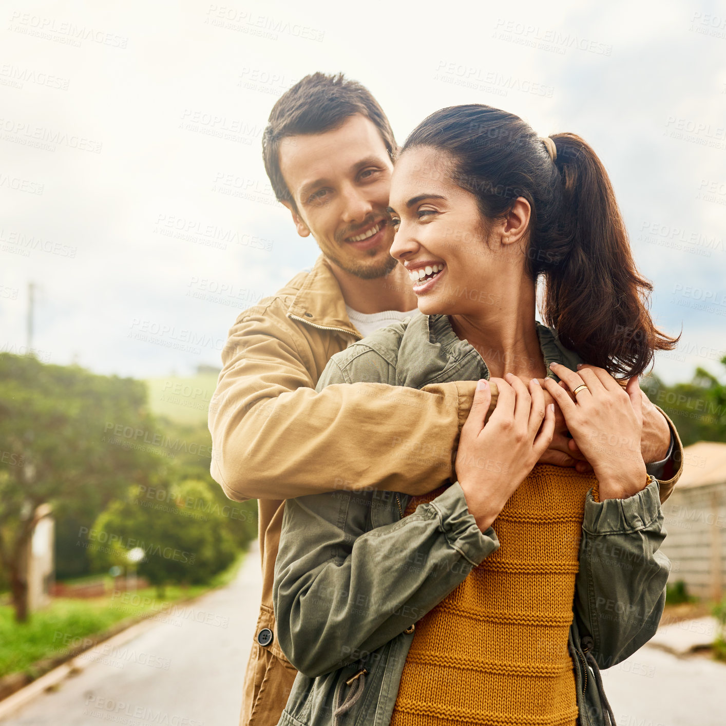 Buy stock photo Cropped shot of an affectionate young couple standing outdoors