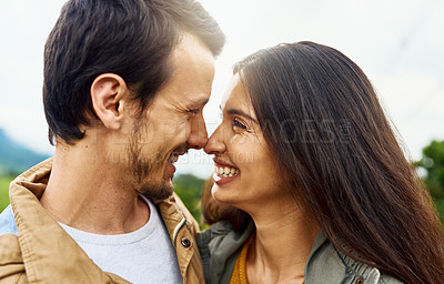 Buy stock photo Shot of an affectionate young couple outdoors