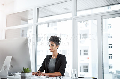 Buy stock photo Typing, smile and woman in office, desk and reading of research for story and creative with inspiration. Happy, online and journalist of news, brainstorming and professional for article in agency