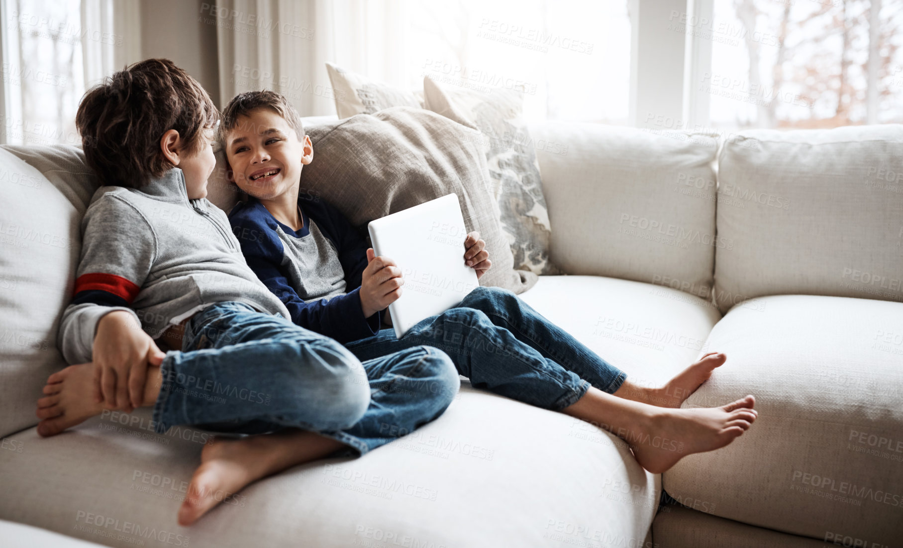 Buy stock photo Relax, family and child siblings with tablet on home sofa for bonding, wellness and streaming smile together. Lounge couch and young kids with app device for online movie entertainment.
