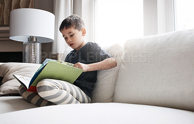 Buy stock photo Child, boy or reading book for education, learning and relax studying on house living room or family home sofa. Kid, storytelling or fantasy fairytale novel for hobby activity or creative inspiration