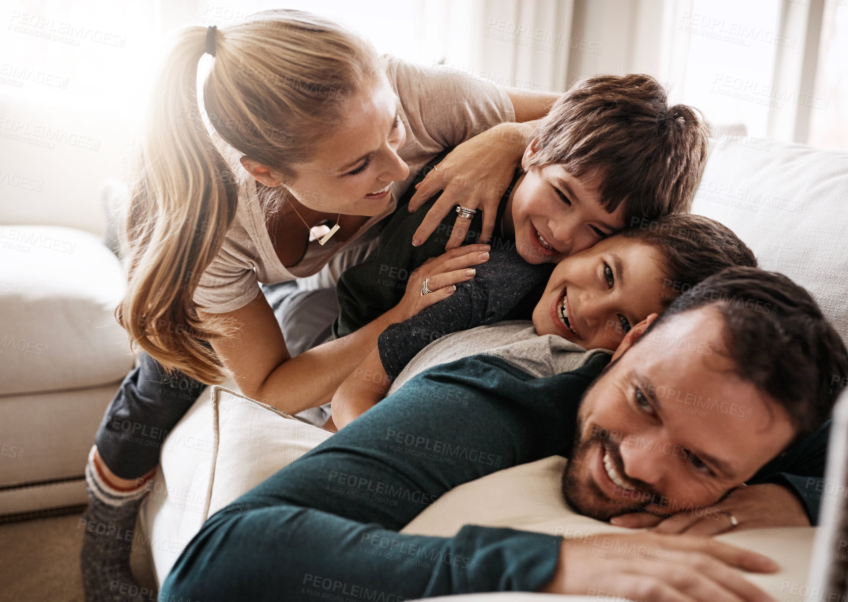 Buy stock photo Shot of a happy family having fun together at home