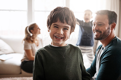 Buy stock photo Portrait of a happy little boy having fun with his family at home