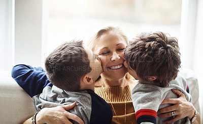 Buy stock photo Happy, kiss and mother with children on sofa for bonding, loving relationship and relax together in home. Family, love and mom with young boys embrace for affection, care and smile in living room