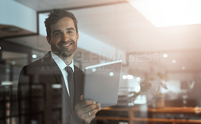 Buy stock photo Portrait of a young businessman using a digital tablet in an office