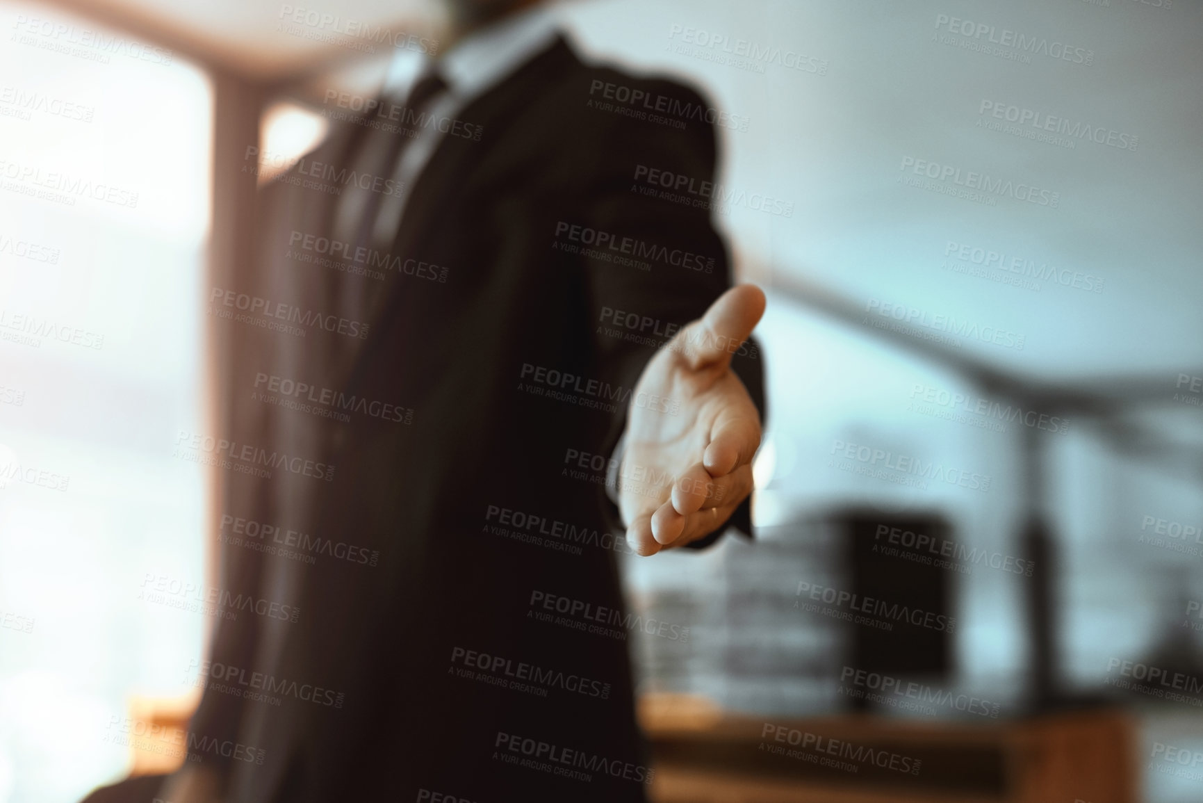 Buy stock photo Closeup shot of an unrecognizable businessman extending a handshake in an office