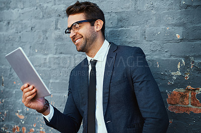 Buy stock photo Tablet, businessman and cheerful with confidence, pride and suit as accountant finance agency. Male person, financial consultant and happy for investment opportunity with stock, tech and gray wall