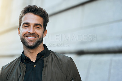Buy stock photo Cropped portrait of a handsome young man traveling through the city