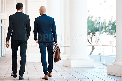 Buy stock photo Rearview shot of unrecognizable businessmen talking outside