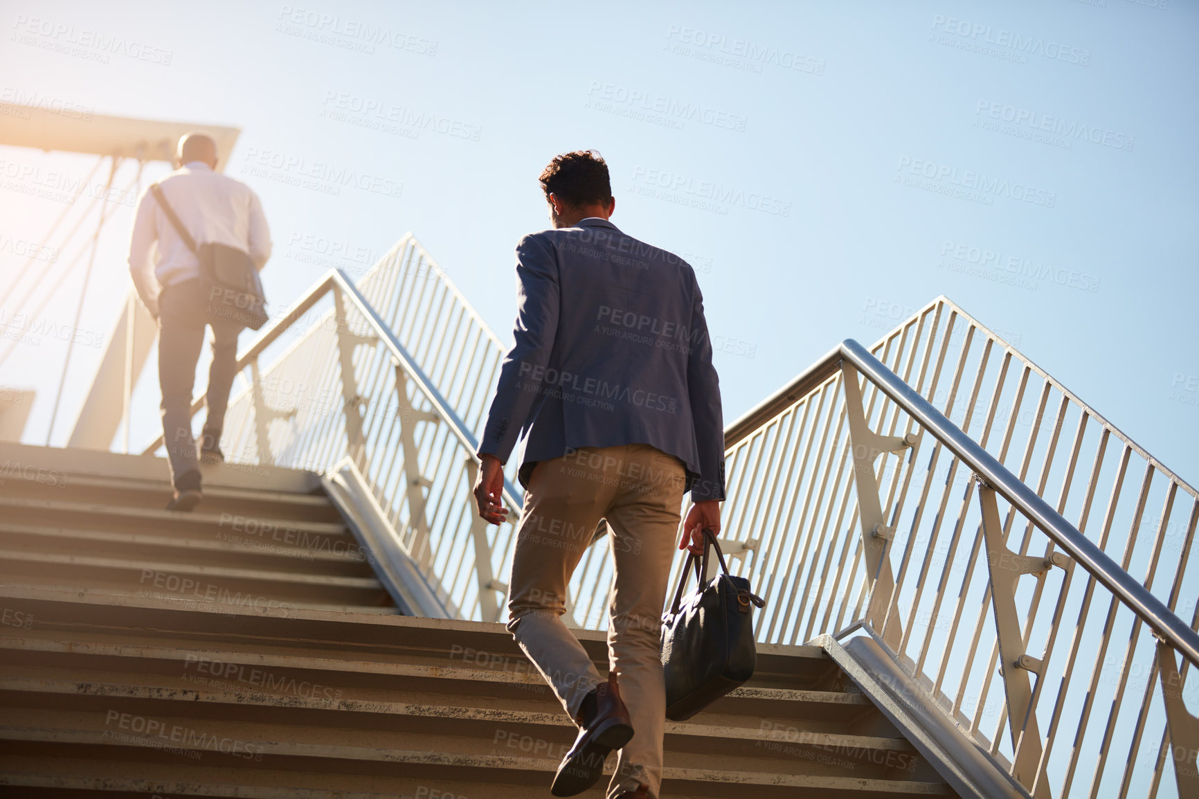 Buy stock photo Business, men and walking on stairs outdoor for commute to work with bag, back and low angle in morning. People, travel and rear view outside on steps in city for transportation, job and location