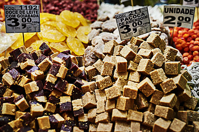 Buy stock photo Shot of a bunch of different delicious treats placed next to each other at a market stall outside during the day