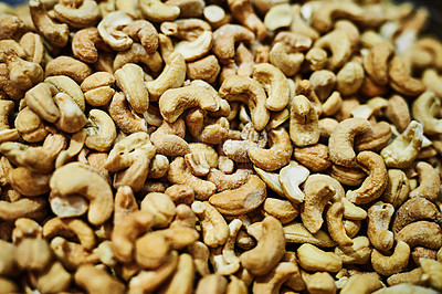 Buy stock photo Shot of numerous amounts of nuts being displayed at a market during the day