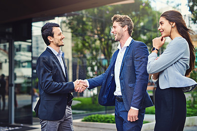 Buy stock photo Shot of businesspeople meeting and greet outside