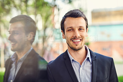 Buy stock photo Portrait of a handsome young businessman outside