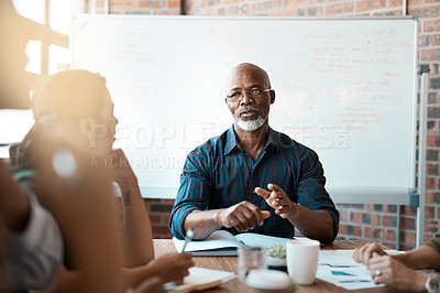 Buy stock photo Business people, meeting and leadership of black man in office, talking or speaking. Teamwork, ceo and senior African male professional brainstorming, collaboration or planning strategy in workplace.