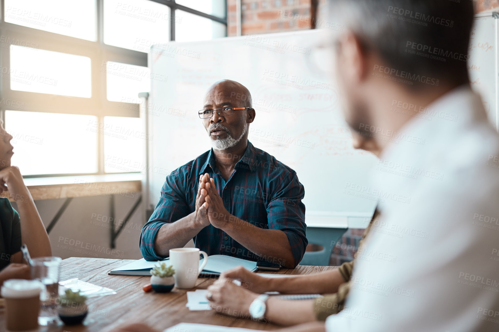 Buy stock photo Business people, meeting leader and black man in office, talking or speaking. Teamwork, ceo and serious senior African male professional brainstorming, collaboration or planning group strategy