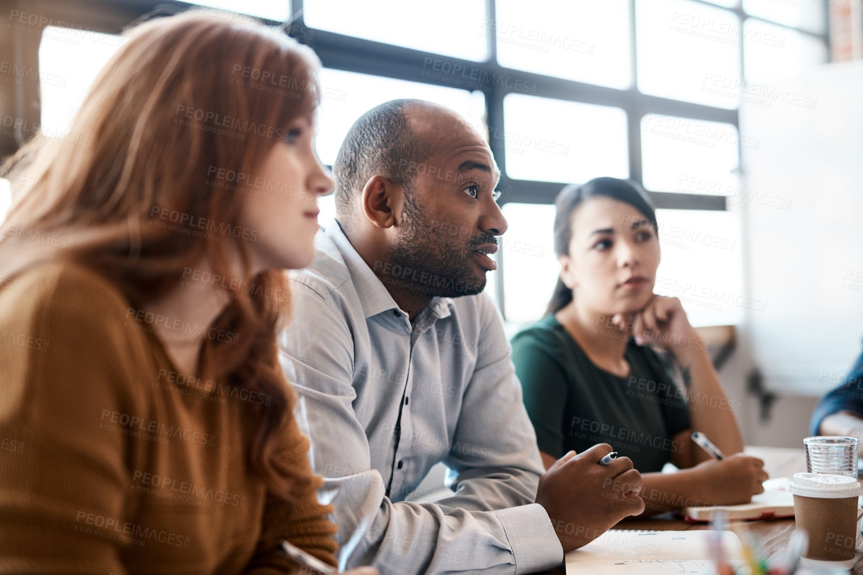 Buy stock photo Cropped shot of businesspeople sitting in the boardroom