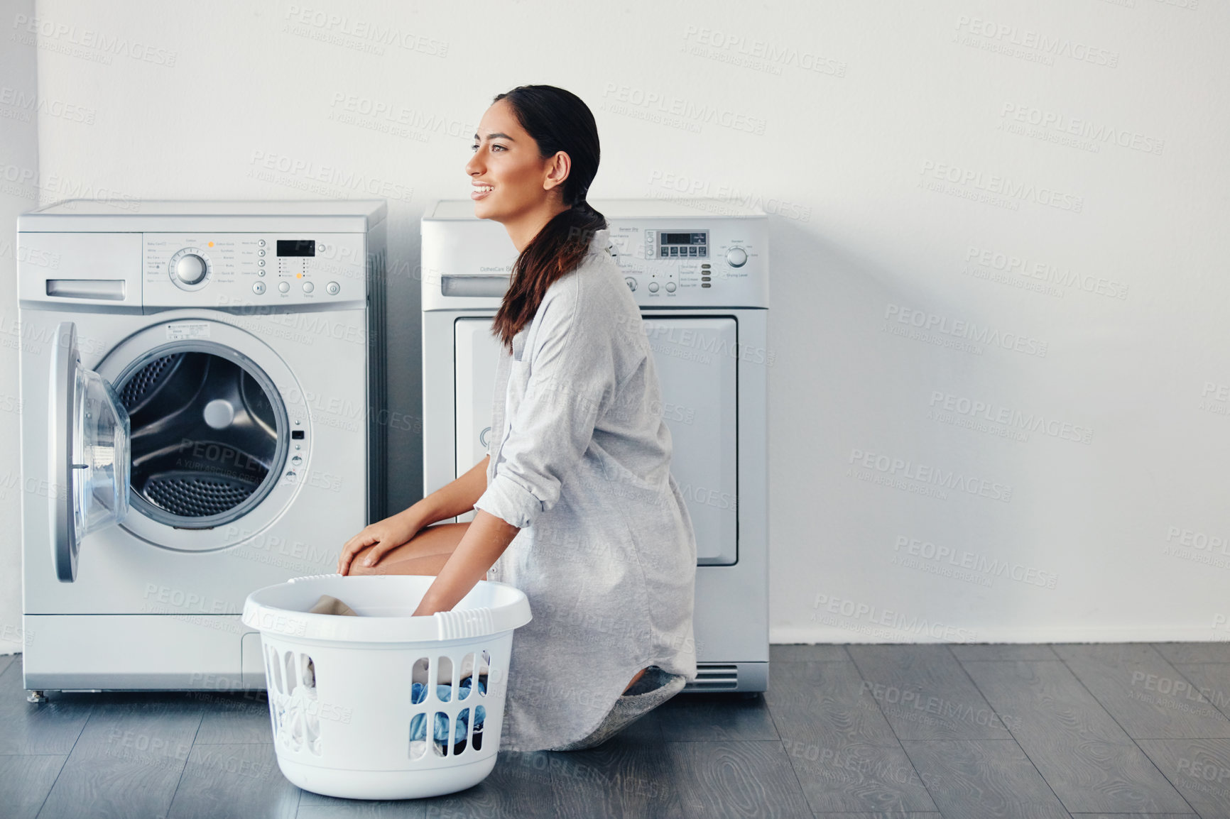 Buy stock photo Happy woman, thinking and laundry or clothes basket for cleaning solution, ideas and fabric in apartment. Young person with vision for washing machine, household appliance and smart home technology