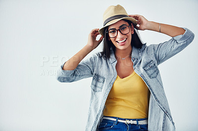 Buy stock photo Studio shot of a beautiful young woman wearing a hat against a white background
