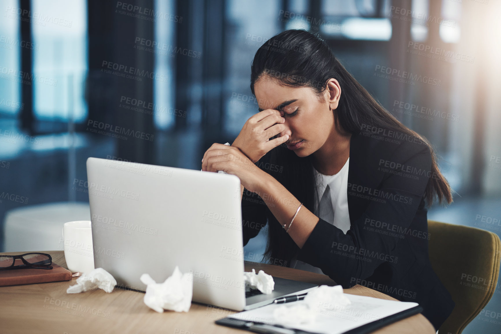 Buy stock photo Headache, sick and businesswoman with tissue in office for flu, fatigue and burnout of bacteria infection. Frustrated, advocate and laptop with medical illness by desk for virus, fever and LB.1 covid