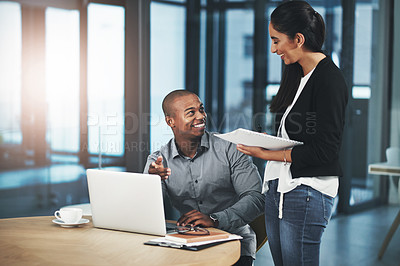 Buy stock photo Shot of two businesspeople having a discussion in an office