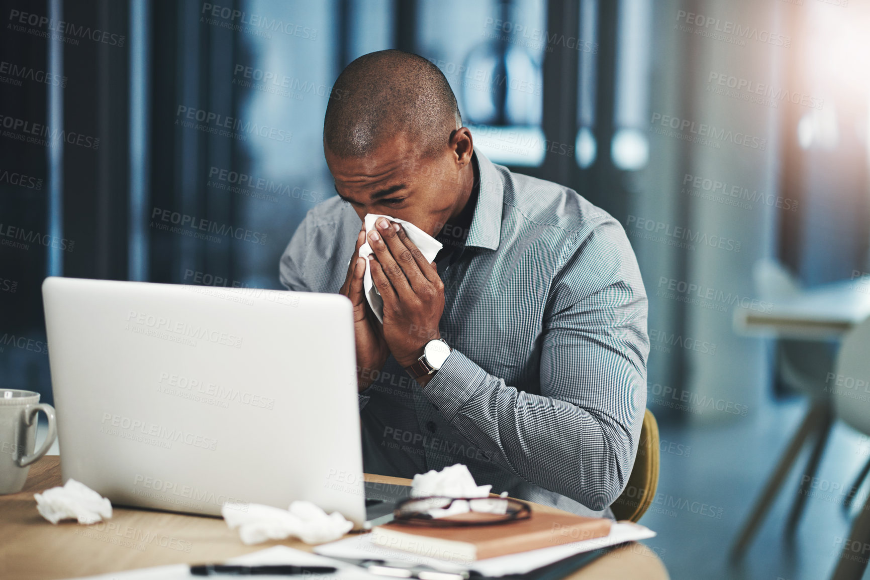 Buy stock photo Sick, businessman and blowing nose with tissue in office for bacteria, infection or congestion. Professional, lawyer and laptop with illness by desk for telehealth, online consultation or LB.1 covid