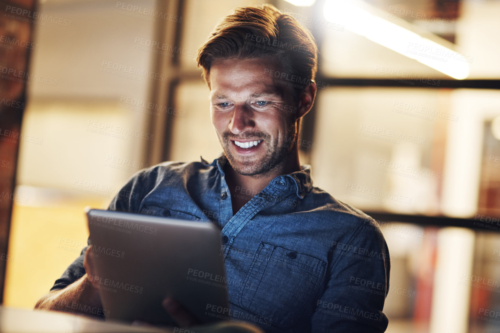 Buy stock photo Night, business and man with a tablet, connection and smile with online reading, research and communication. Person, evening and employee with tech, email notification and internet with digital app