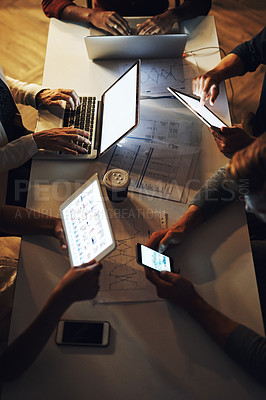 Buy stock photo High angle shot of a group of unrecognizable designers having a brainstorming session in the boardroom