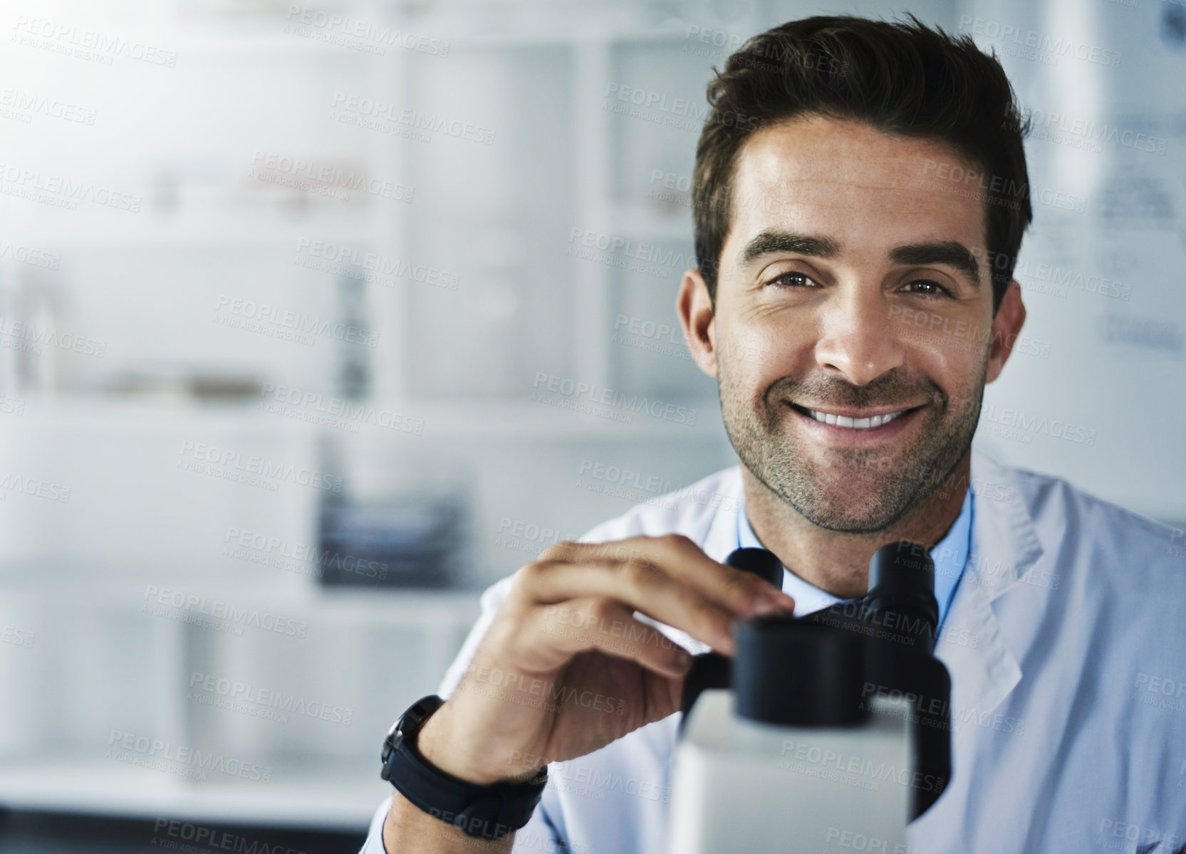 Buy stock photo Portrait of a scientist using a microscope in a lab
