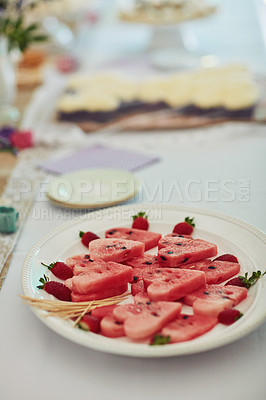 Buy stock photo Shot of watermelon cut into heart shapes on a table at a tea party inside