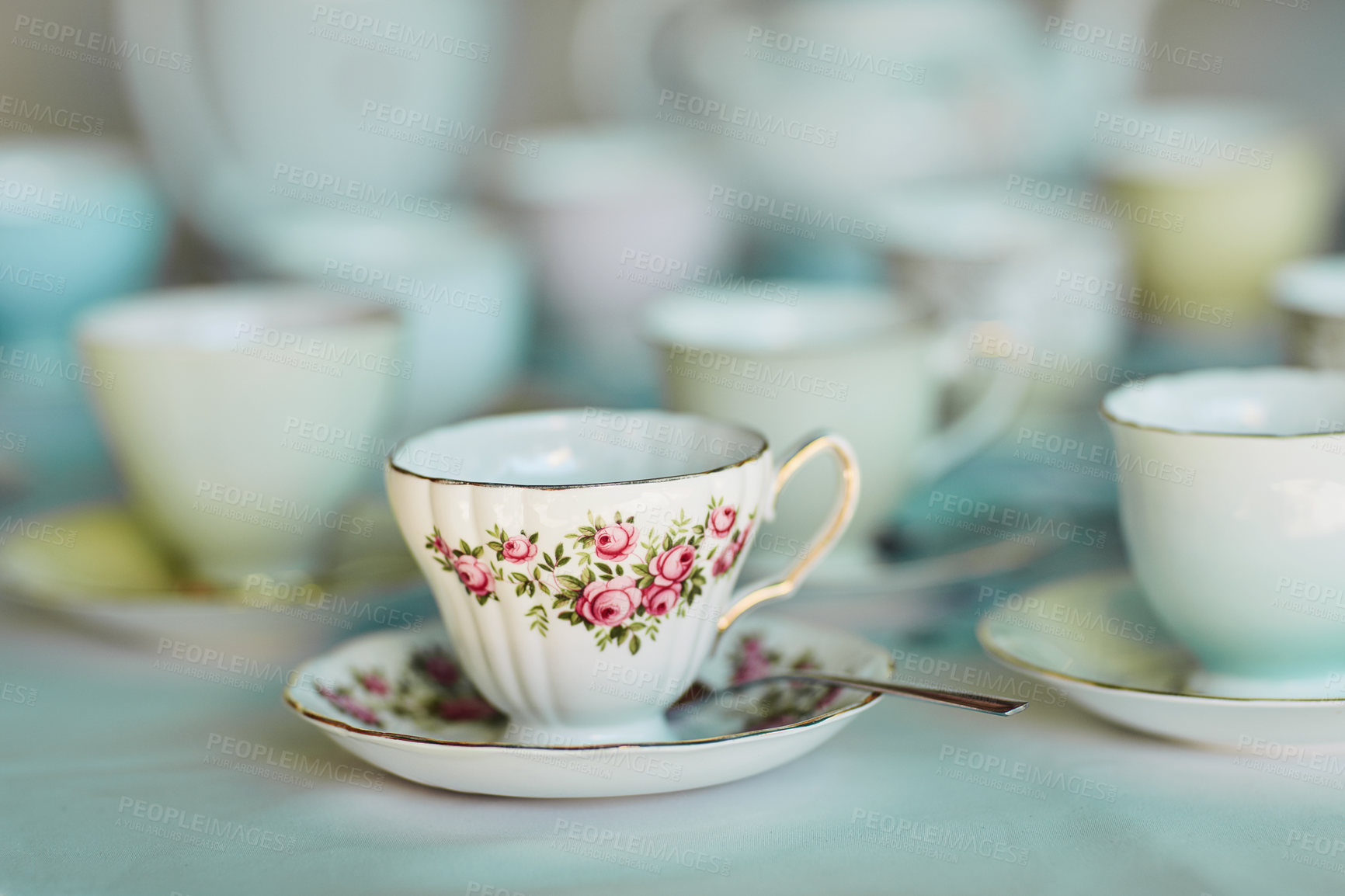 Buy stock photo Closeup shot of tea cups laid out on a table at a tea party inside