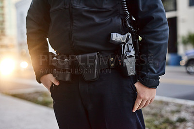 Buy stock photo Closeup shot of an unrecognizable policeman out on patrol