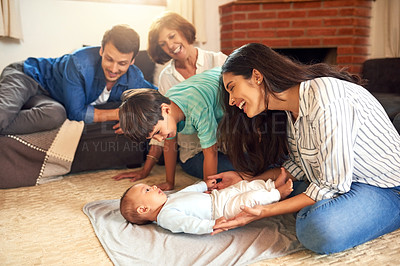Buy stock photo Cropped shot of an affectionate young family spending quality time together at home