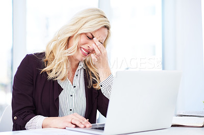 Buy stock photo Cropped shot of a young businesswoman looking very frustrated while working in her office