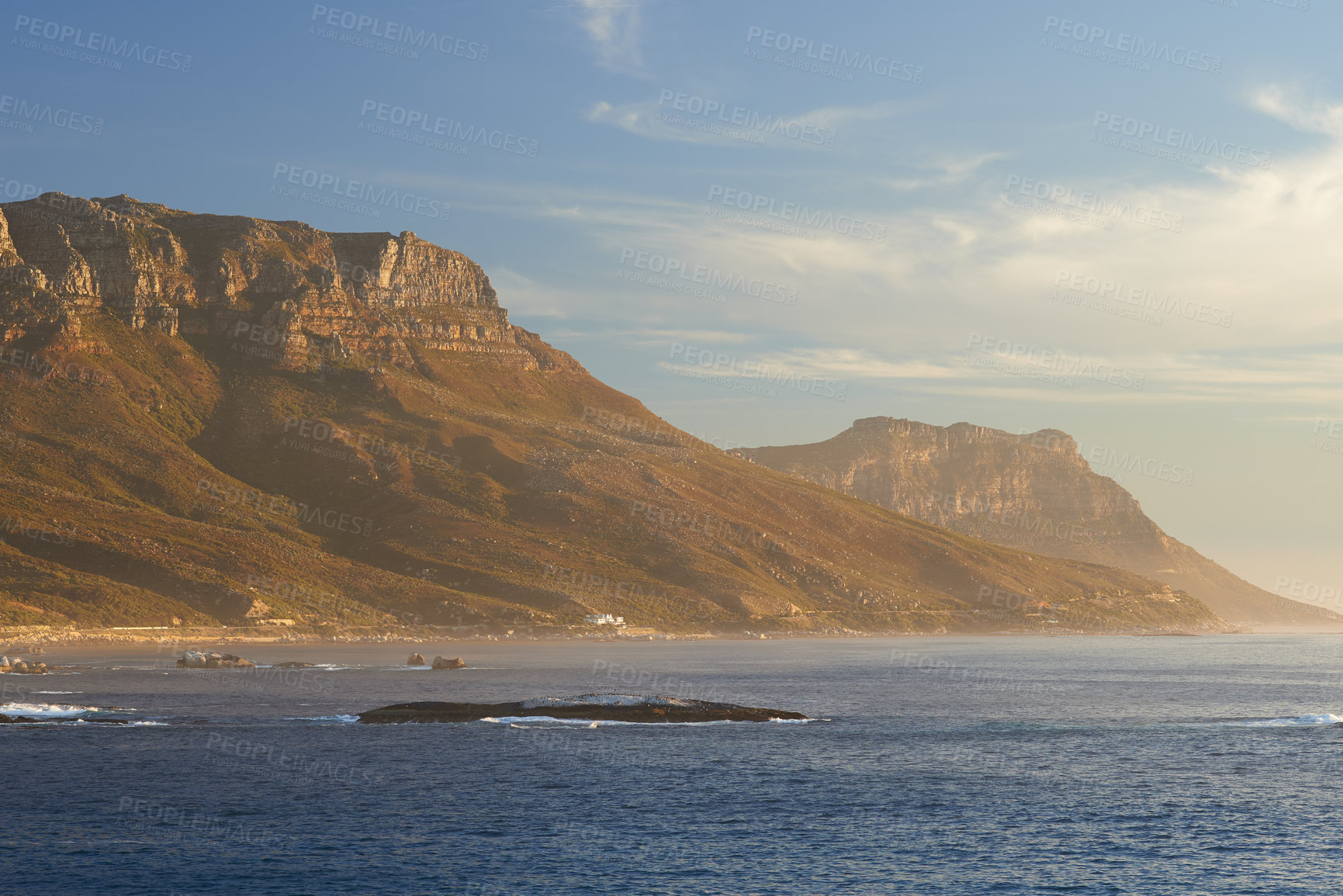 Buy stock photo Landscape, sea, beach and mountain view of the Twelve Apostles in Cape Town, South Africa. Calm ocean with blue sky and copy space washing onto shores of famous hiking, travel or tourism destination