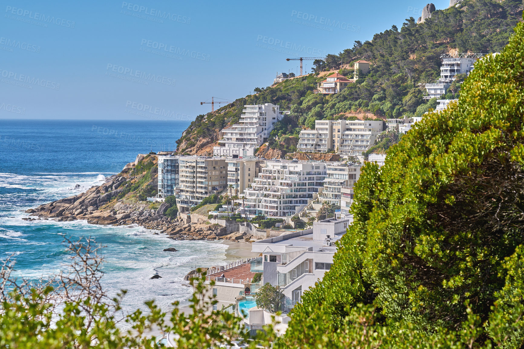 Buy stock photo Clifton, Cape Town, South Africa panorama seascape with clouds, blue sky, hotels, and apartment buildings in the background. Housing development overlooking the beautiful blue ocean peninsula