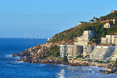 Buy stock photo Clifton, Cape Town, South Africa panorama seascape with clear blue sky, hotels, and apartment buildings in the background. Housing development overlooking the beautiful blue ocean peninsula
