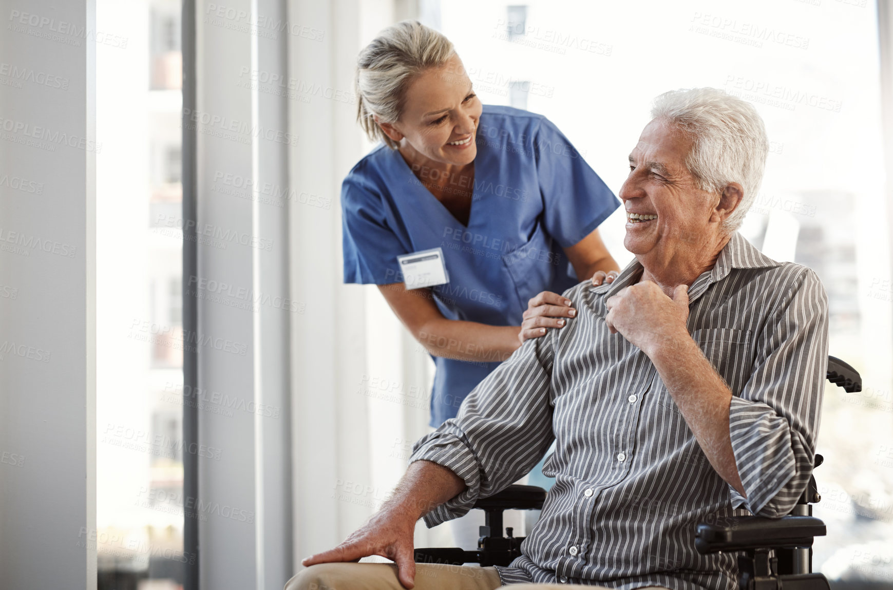 Buy stock photo Patient, nurse and woman with wheelchair, consulting and conversation with healthcare, recovery and service. Senior man, professional and person with disability, rehabilitation and support with joke