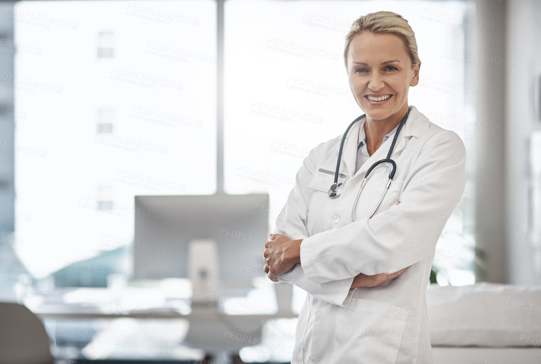 Buy stock photo Doctor, confident and portrait in hospital for healthcare, career path and smile in office space. Mature woman, cardiologist and arms crossed in clinic for friendly service, positivity and trust